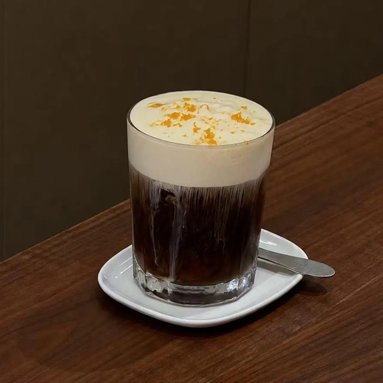 Orange Americano with creamy foam at On Lab，a Creative Cafe and Bistro in New York